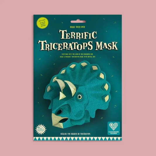 Packaged DIY Triceratops mask kit by Chocolate Cookie, featuring a dark teal cardboard backing with a large illustration of a green Triceratops and the text 'Terrific Triceratops Mask'.