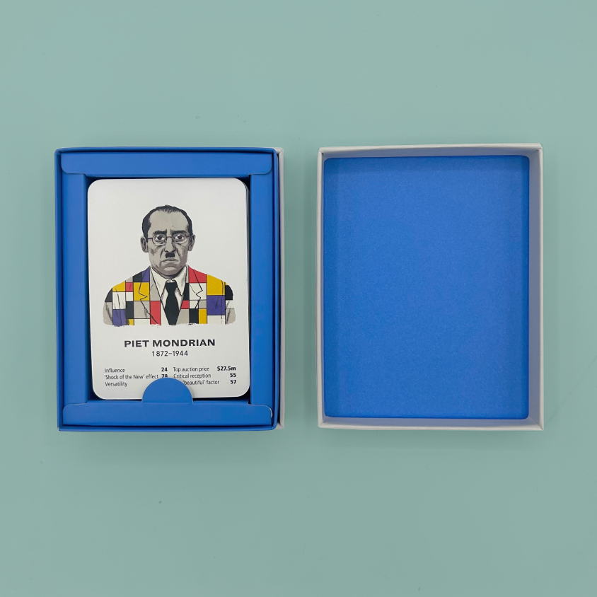 A blue presentation box with a printed portrait card of Piet Mondrian on the left, shown beside its open blue lid on a light blue-green background.