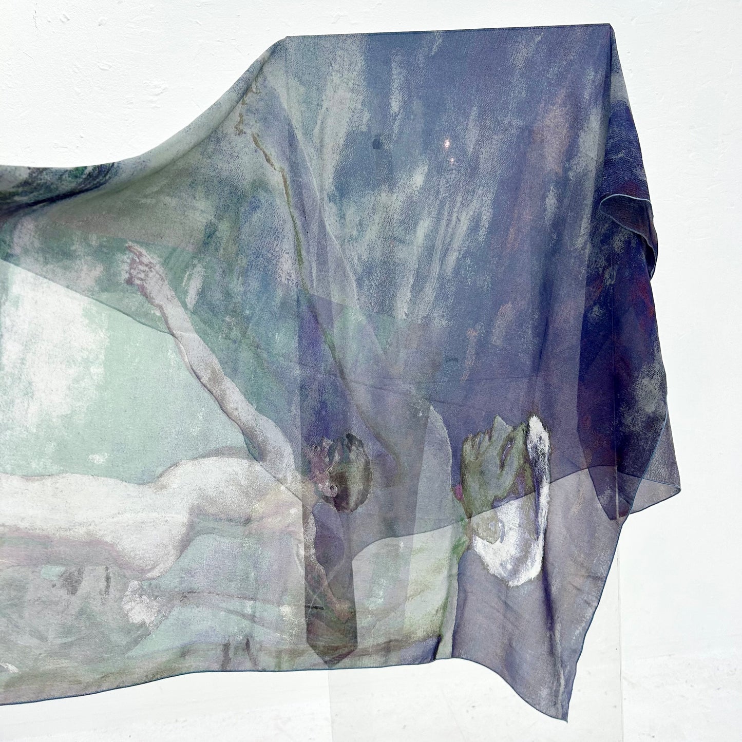 Blue scarf with a design of boys, on a white background. 
