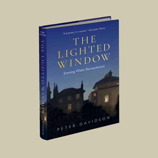 The Lighted Window: Evening Walks Remembered by Peter Davidson, a hardcover book with a dark blue cover and gold lettering, shown at an angle on a solid beige background.