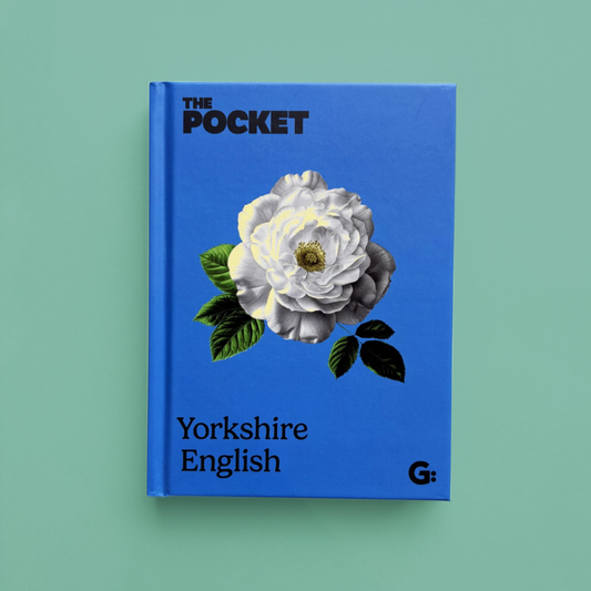 Blue book titled 'The Pocket Yorkshire English' with a floral design on a green background.