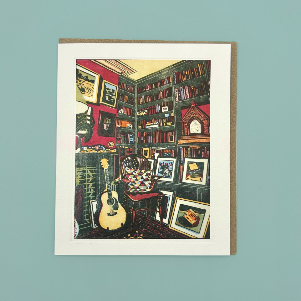 Greeting card with a colorful illustration of a cozy room filled with books and musical instruments on a light blue background.