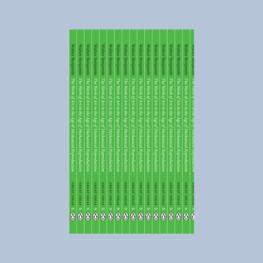 Front cover of 'The Work of Art in the Age of Mechanical Reproduction' which has an illustration of repeated book spines which are green on a  with white text. The book is on a light blue background.