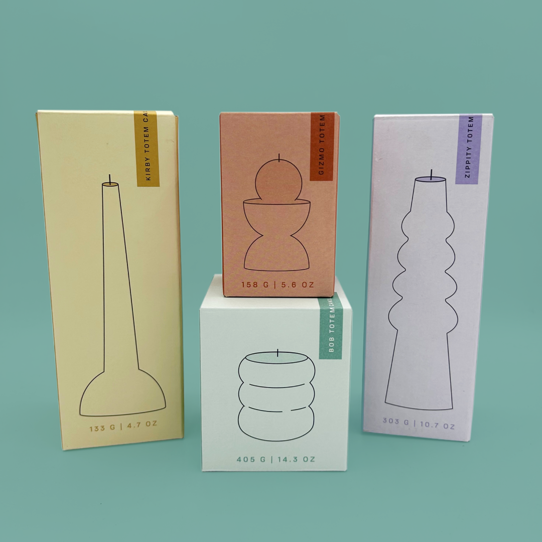 Four pastel coloured boxes for paddywax totem candles.