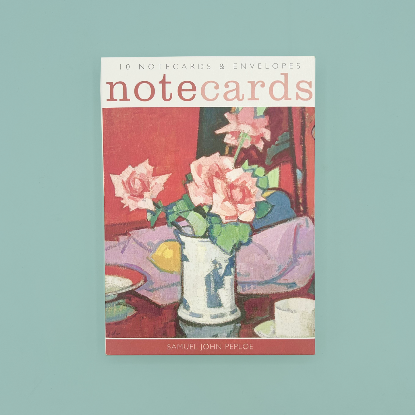 Notecard packaging with floral illustration on a light blue background
