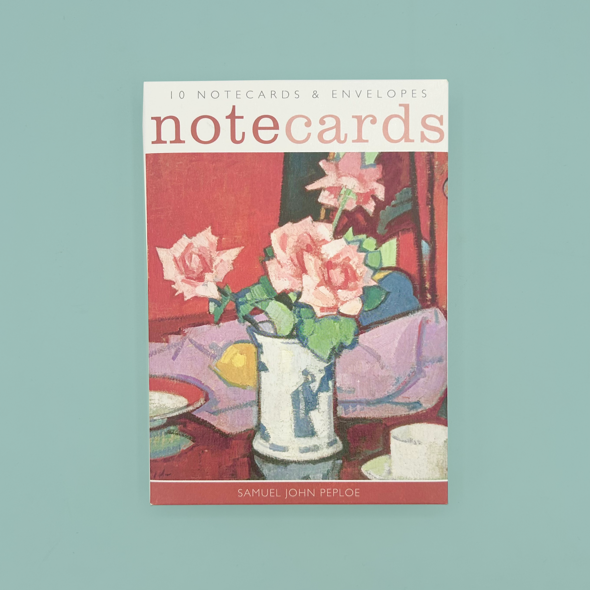 Notecard packaging with floral illustration on a light blue background