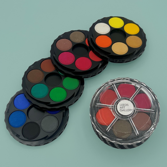 Set of water colour palettes on a light blue background