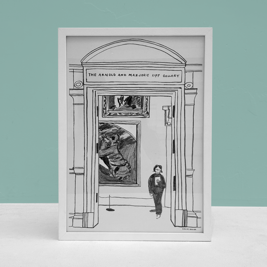 Framed black and white artwork of a gallery interior with a person standing in front of a large painting.