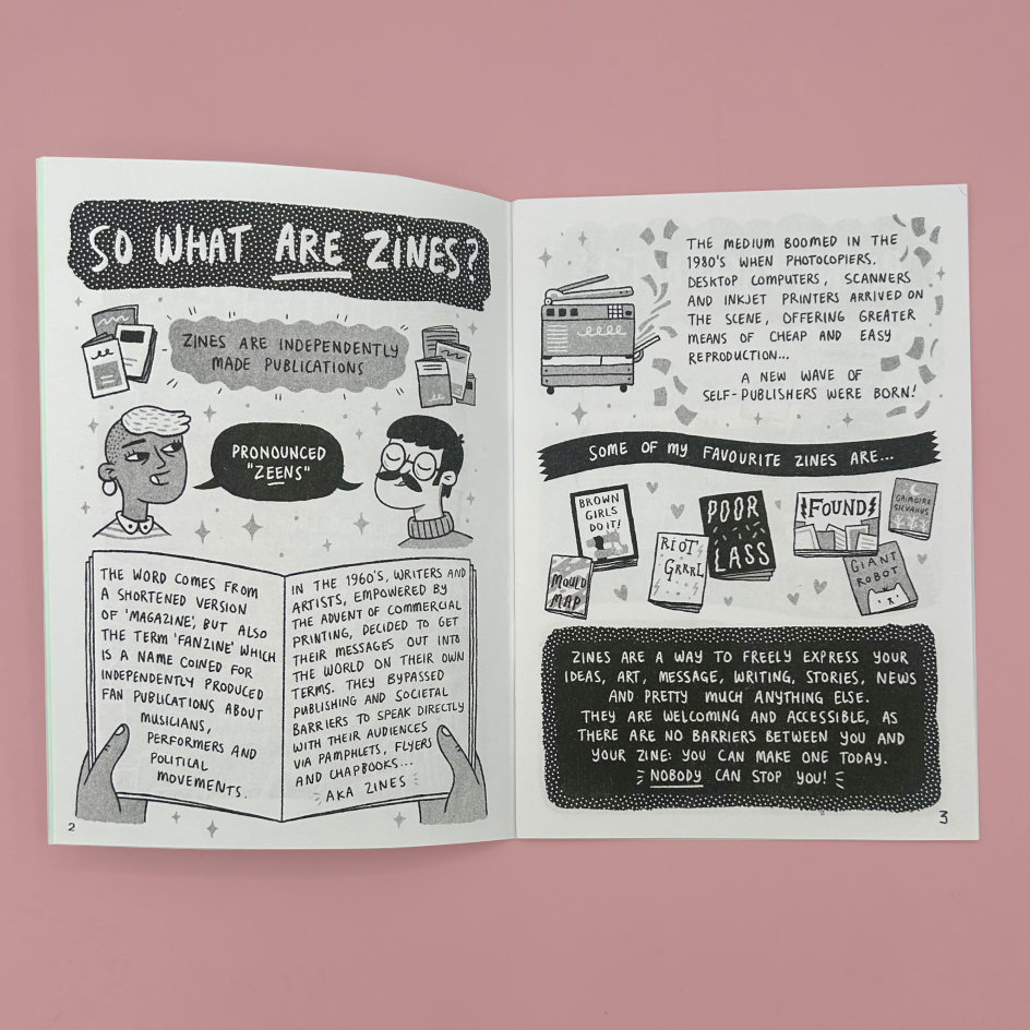 A zine spread with illustrated black-and-white text panels about zines, photographed against a solid pink background.